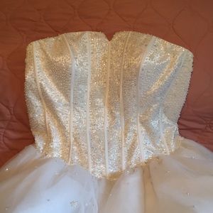 Breathtaking white wedding or quince ball gown from Mary's Bridal.